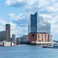 Hamburg, elbphilharmonie and modern buildings with boat to the harbor tour